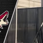 Arizona Coyotes temporary visiting dressing rooms revealed Picture of man working on Mullett Arena visitor dressing room
