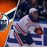 Evander Kane holding his wrist after being cut by a skate