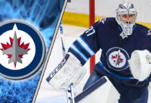 Picture of Connor Hellebuyck. The latest NHL trade rumors have him staying in Winnipeg.