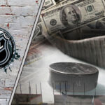 Picture of a hockey stick and a puck with money in the background.