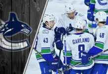 Picture of the Vancouver Canucks celebrating a goal.
