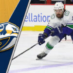 Nashville Predators Eyeing Conor Garland: A Perfect Fit in Music City Picture of Vancouver Canucks forward Conor Garland skating with the puck.