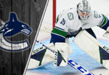 Picture of Vancouver Canucks goalie Thatcher Demko making a save.