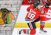 Connor Bedard celebrating historic 4-point game with Chicago Blackhawks teammates.