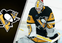 Pittsburgh Penguins goaltender Alex Nedeljkovic making a save during a game.