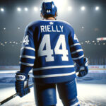 Bettman’s Hammer Falls: Rielly’s Cross-Check Appeal Denied, Five-Game Ban Stands NHL Commissioner Gary Bettman, Morgan Rielly of the Toronto Maple Leafs, NHL ice rink