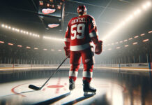 Jake Guentzel in a Red Wings jersey, celebrating a goal