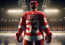 Moritz Seider, Detroit Red Wings defenseman, skates with the puck wondering about his new contract
