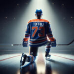 Photo of Tyler Toffoli in Edmonton Oilers uniform skating with the puck.