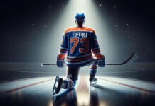 Photo of Tyler Toffoli in Edmonton Oilers uniform skating with the puck.