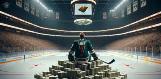 Minnesota Wild defenseman Brock Faber sitting on a stack on money thinking about his next contract