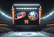 Carolina Hurricanes and New York Islanders hockey teams facing off on the ice