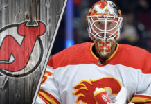 Close-up photo of Jacob Markstrom in a Calgary Flames jersey making a save.