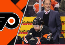 John Tortorella coaching the Philadelphia Flyers on the bench.