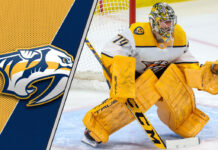 Close-up image of Juuse Saros in Nashville Predators goalie gear making a save.