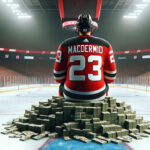 New Jersey Devils Ink Kurtis MacDermid to 3-Year Extension | NHL News Kurtis MacDermid sitting on a stack on money after his contract extension in his New Jersey Devils uniform