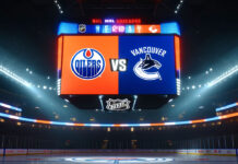 Vancouver Canucks and Edmonton Oilers logos on an NHL scoreboard