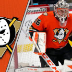 Anaheim Ducks goalie John Gibson skates towards the net, making a save during an NHL game.