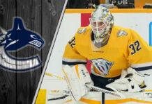 Kevin Lankinen in a Nashville Predators jersey making a save