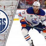 The Connor McDavid Loyalty: Edmonton’s Ace in the Hole Connor McDavid in an Edmonton Oilers jersey, skating with the puck