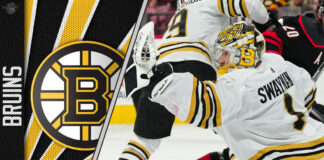 Jeremy Swayman, Boston Bruins goalie, stands tall in net during an NHL game.
