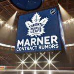 Mitch Marner’s Contract Demands Skyrocket After Draisaitl Extension Toronto Maple Leafs logo with the words Marner contract rumors below the logo