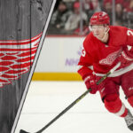 Lucas Raymond celebrates a goal in his Detroit Red Wings jersey, signifying a bright future for the team