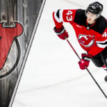 Devils’ Rising Star Luke Hughes Sidelined with Shoulder Injury Luke Hughes of the New Jersey Devils skates with the puck during an NHL game