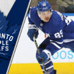 Nick Robertson Trade Still Likely Despite New Leafs Contract Nick Robertson in a Toronto Maple Leafs jersey looking pensive