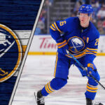 Rasmus Dahlin wearing the Buffalo Sabres jersey with the captain's "C" on it.