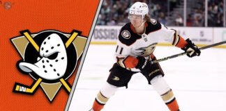 Trevor Zegras in an Anaheim Ducks jersey skating with the puck