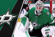 Jake Oettinger making a save in a Dallas Stars uniform.