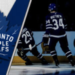 Leafs’ Stars Struggle: Matthews, Marner, and Nylander Held Off the Scoresheet Auston Matthews, Mitch Marner, and William Nylander looking concerned on the Leafs bench.