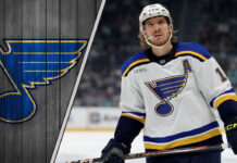 St. Louis Blues center Robert Thomas grimaces in pain after blocking a shot.