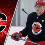 Flames Ink Barrie to One-Year Contract Tyson Barrie skating with the puck in a Calgary Flames jersey