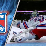 Igor Shesterkin in his New York Rangers goalie mask making a save.