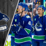 Elias Pettersson and J.T. Miller celebrate a Vancouver Canucks goal.