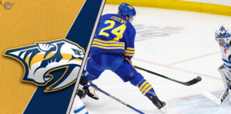 Dylan Cozens of the Buffalo Sabres skates with the puck.