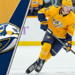 Juuso Parssinen skating with the puck during a Nashville Predators game.