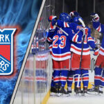 New York Rangers Rumors: Blockbuster Trade Brewing in the Big Apple? New York Rangers players huddled on the ice during a game.