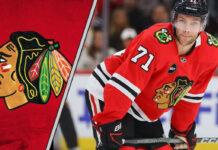 Taylor Hall in Chicago Blackhawks jersey looking determined
