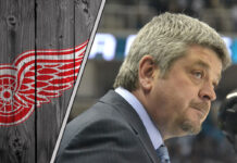 Todd McLellan coaching on the bench in a Detroit Red Wings game