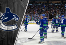 Vancouver Canucks GM Patrik Allvin on the phone working on a trade.
