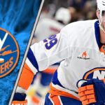 Brock Nelson in New York Islanders jersey, looking focused on the ice