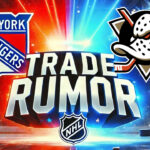 Zegras for Lafreniere? Wild NHL Trade Rumor Swirling Around Rangers & Ducks New York Rangers and Anaheim Ducks logos with the words trade rumor below the logos