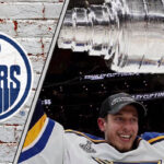 Jordan Binnington to Edmonton? Oilers Trade Rumors Heat Up! Jordan Binnington in a St. Louis Blues jersey holding the Stanley Cup above his head.