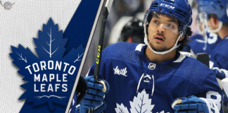 Nick Robertson skating during a Toronto Maple Leafs game, trade rumors swirling ahead of NHL deadline.