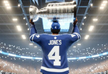Seth Jones in a Toronto Maple Leafs jersey holding the Stanley Cup above his head