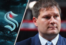 Jason Botterill introduced as new Seattle Kraken GM in front of team logo