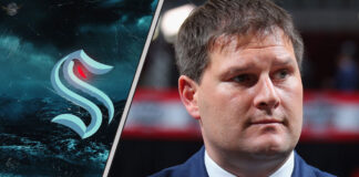 Jason Botterill introduced as new Seattle Kraken GM in front of team logo